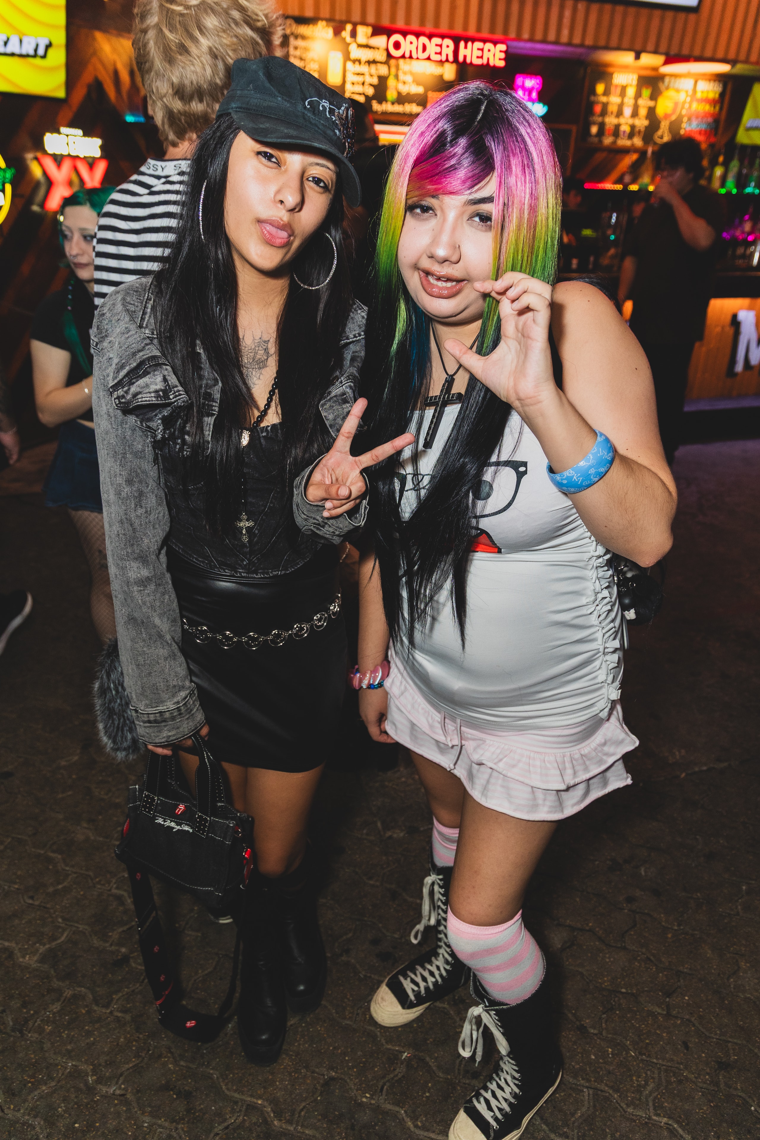 Two attendees with colorful hair at SATX Emo Club