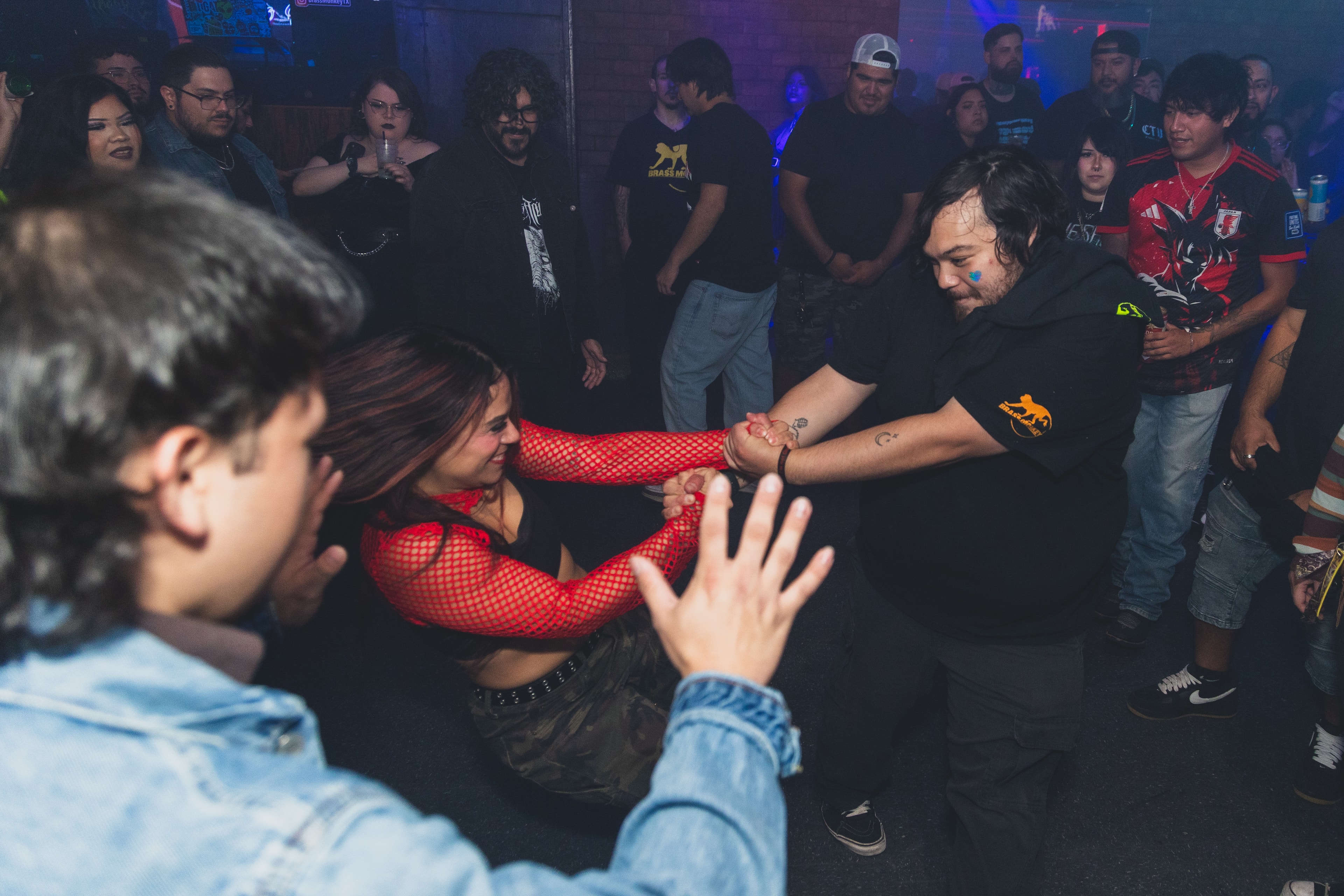Dancers at SATX Emo Club with crowd watching