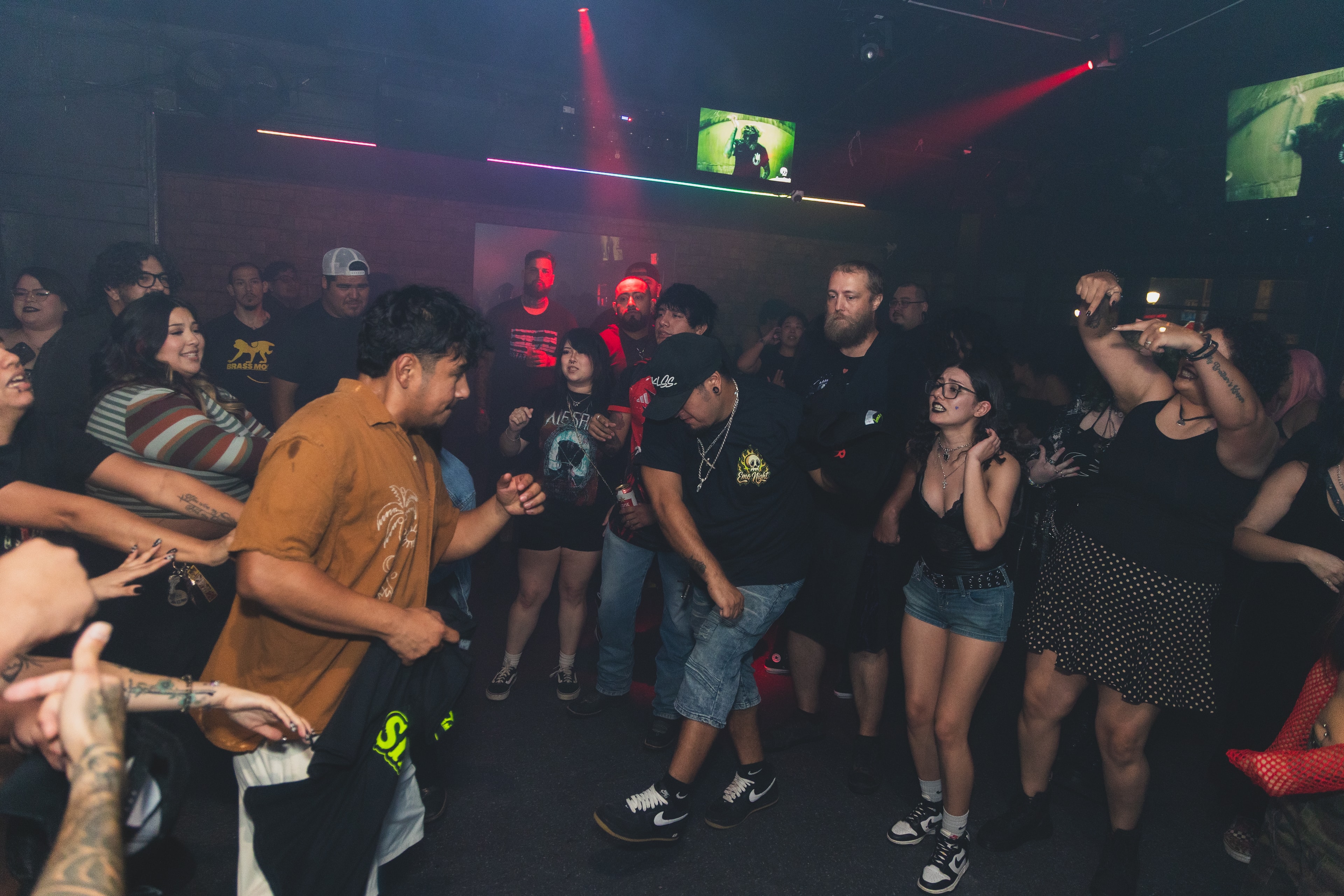 Two attendees dancing face to face at SATX Emo Club