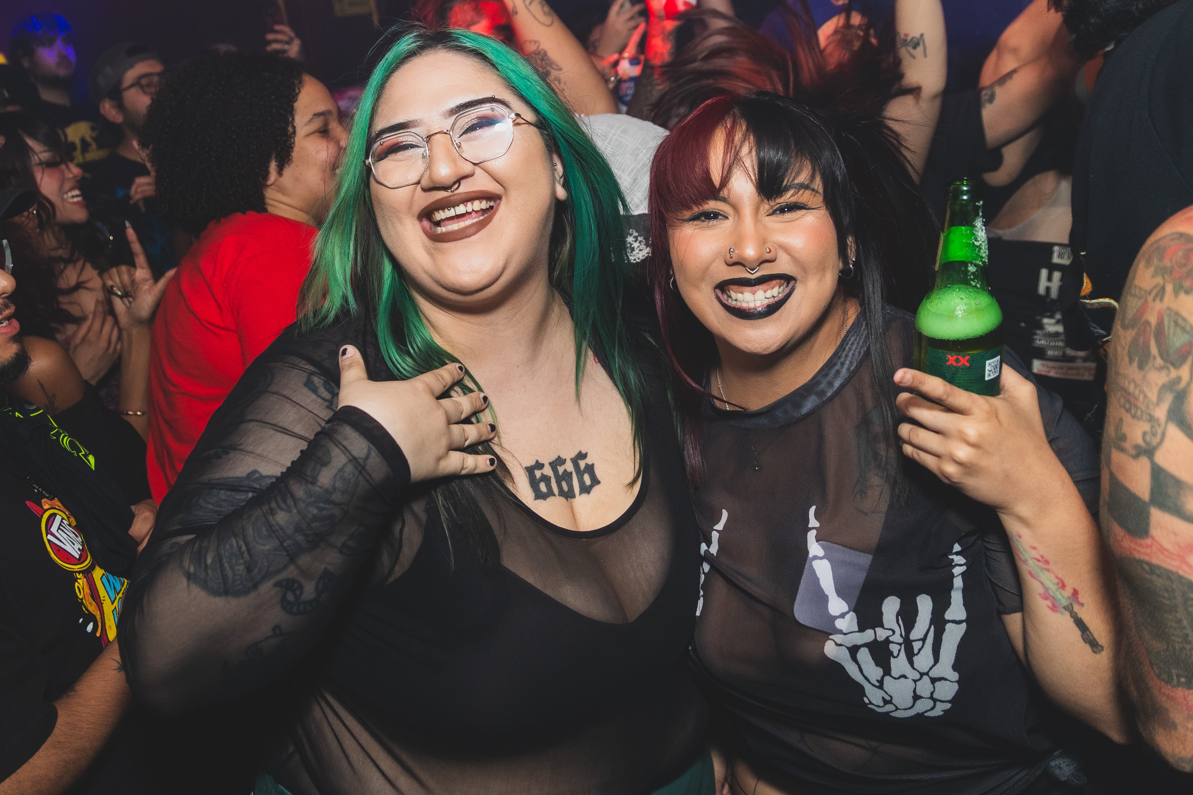 Two friends with colorful hair smiling at SATX Emo Club