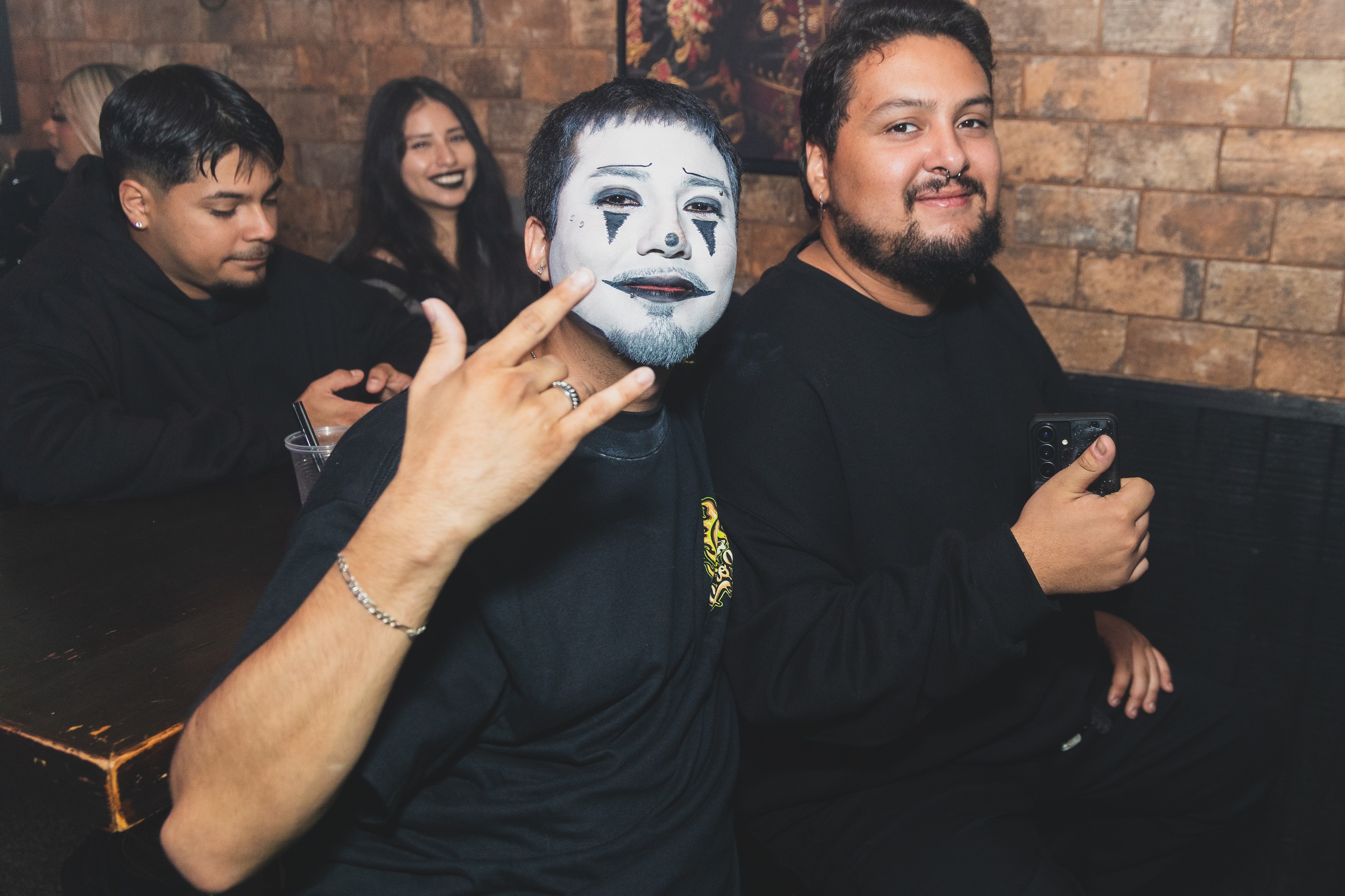 Group wearing clown face paint at SATX Emo Club