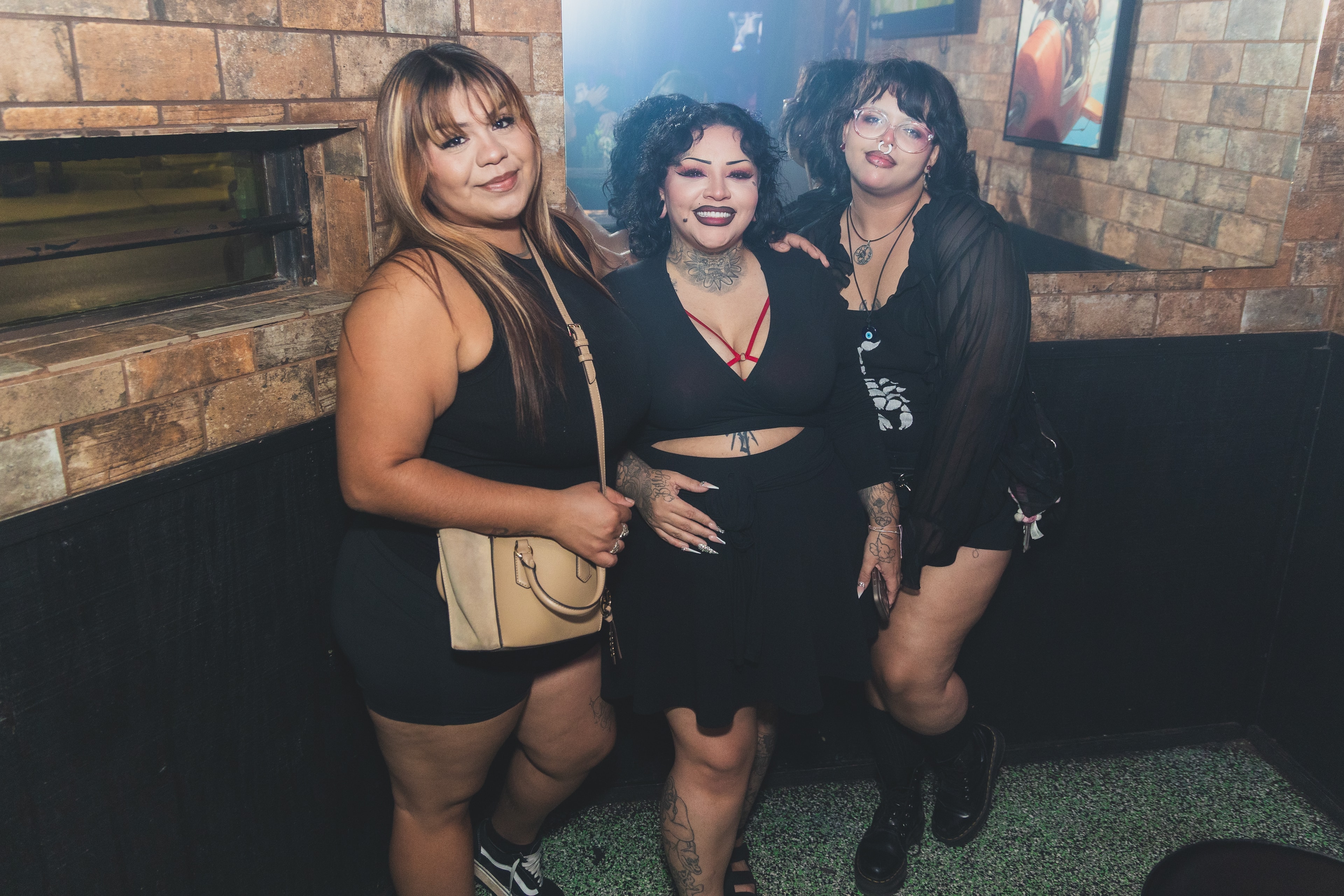 Three women posing together at SATX Emo Club
