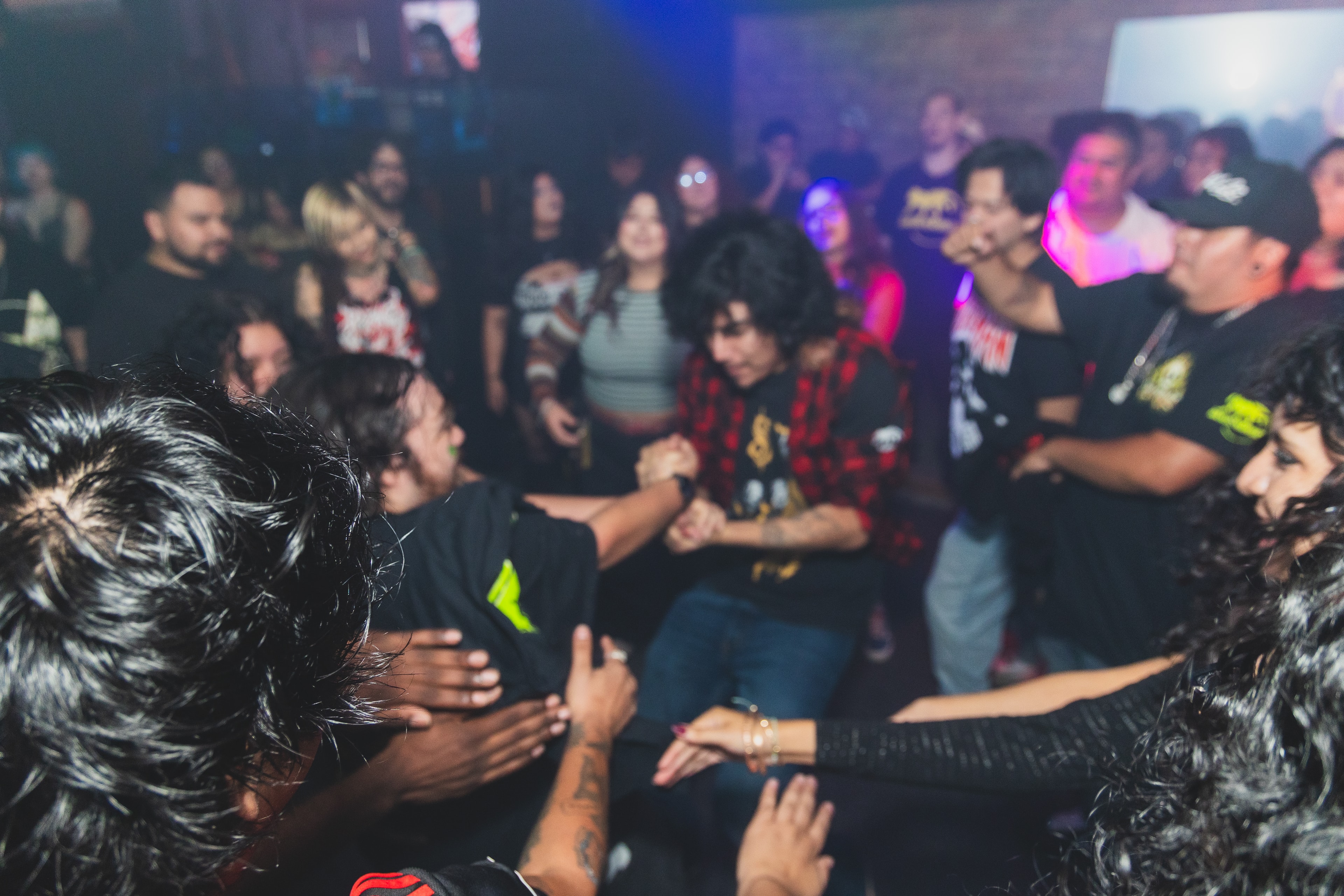 Crowd forming a circle on the dance floor at SATX Emo Club